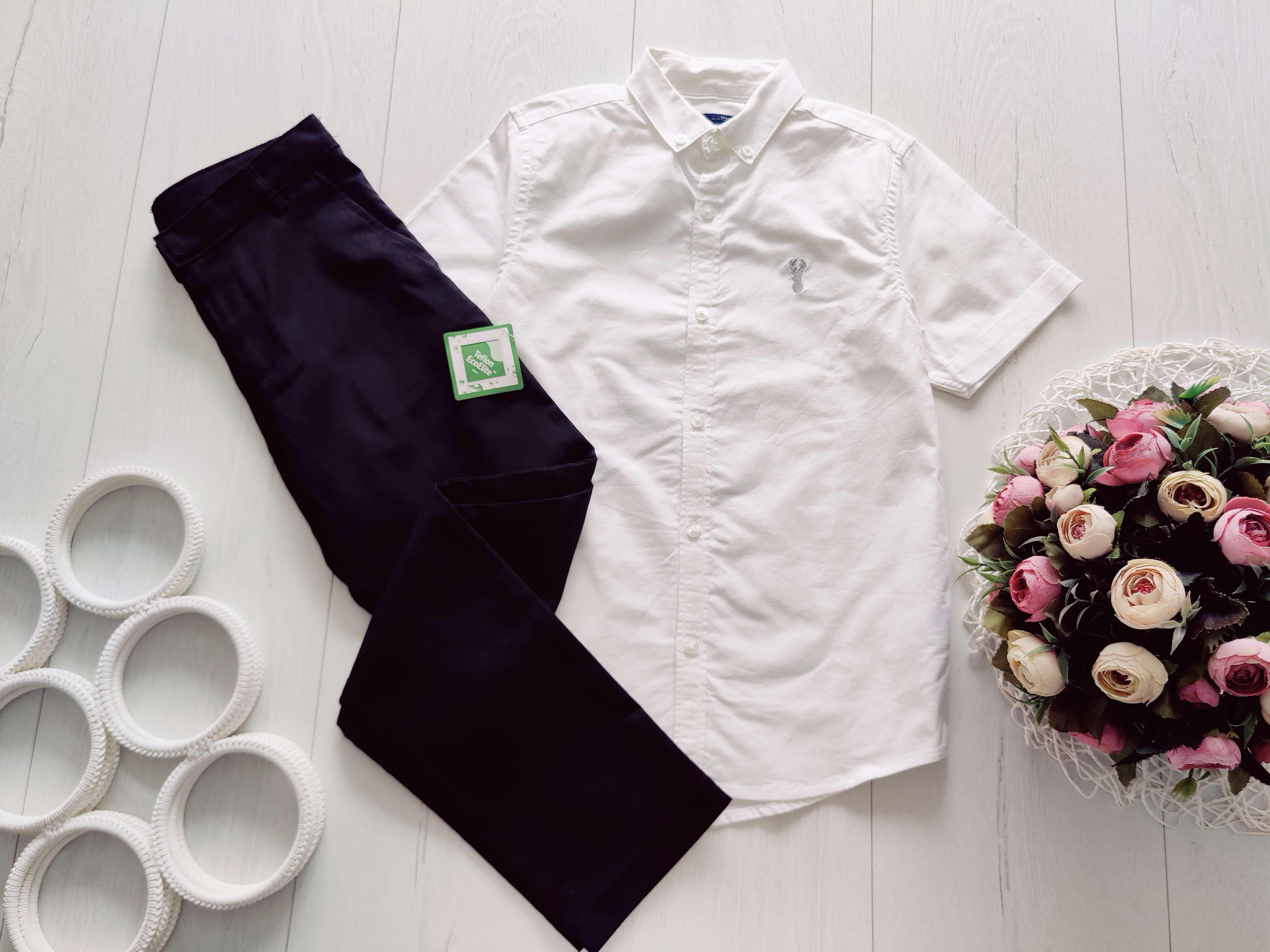 8,9 років, зріст 128,134 Нові штани і біла сорочка