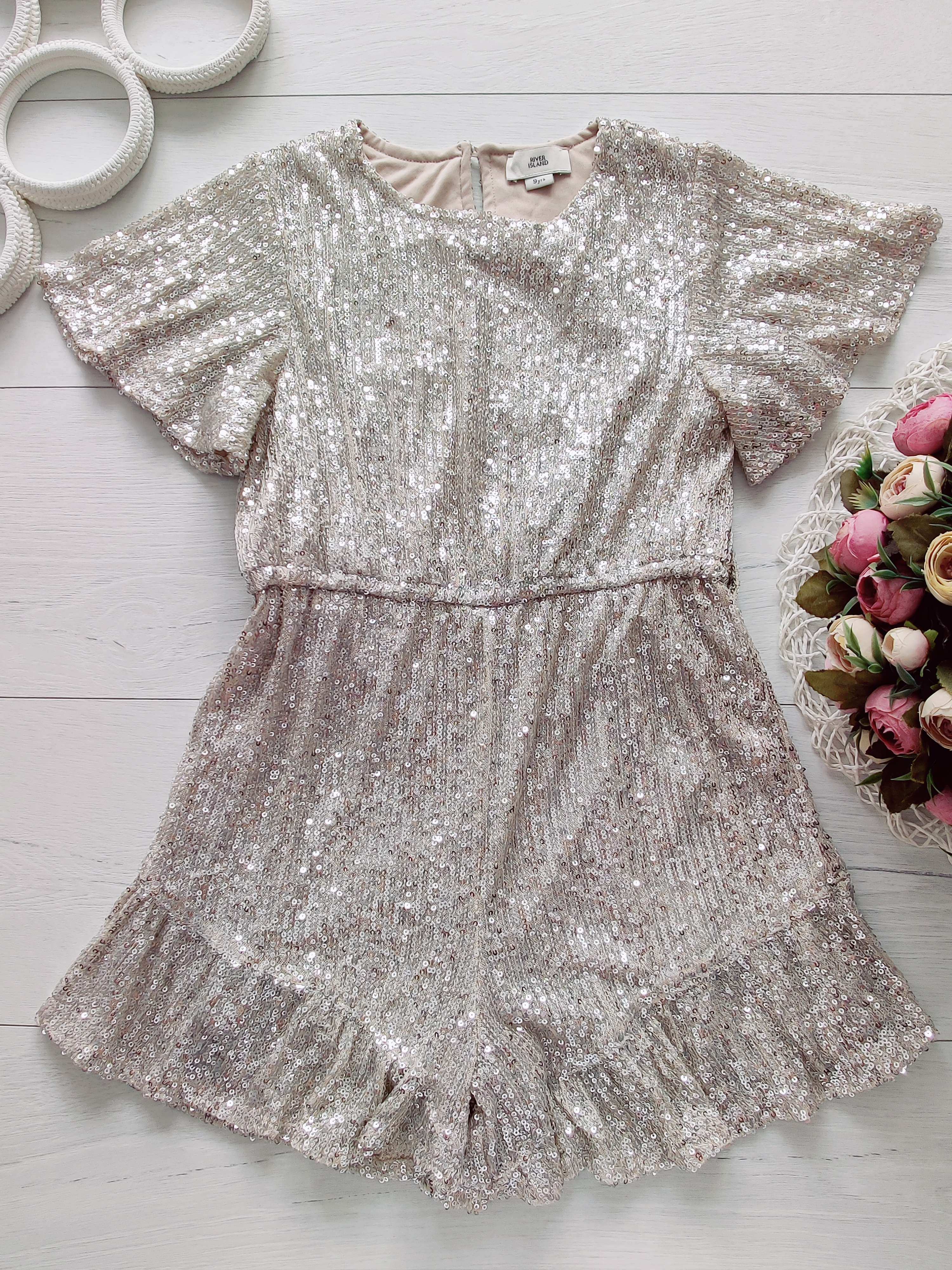 9 років, зріст 134 Ошатний блискучий ромпер у паєтках золото